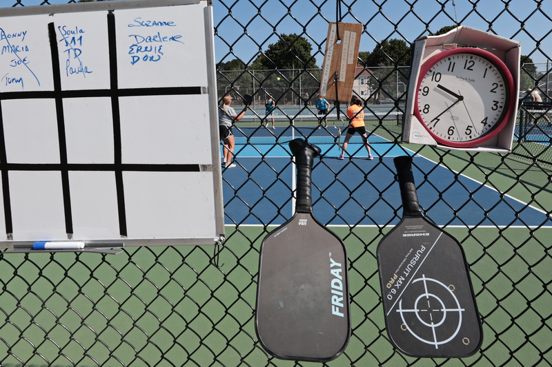 A man rows out into New Bedford harbor aboard his boat Papillon from a boat ramp in Fairhaven, MA. PHOTO PETER PEREIRA