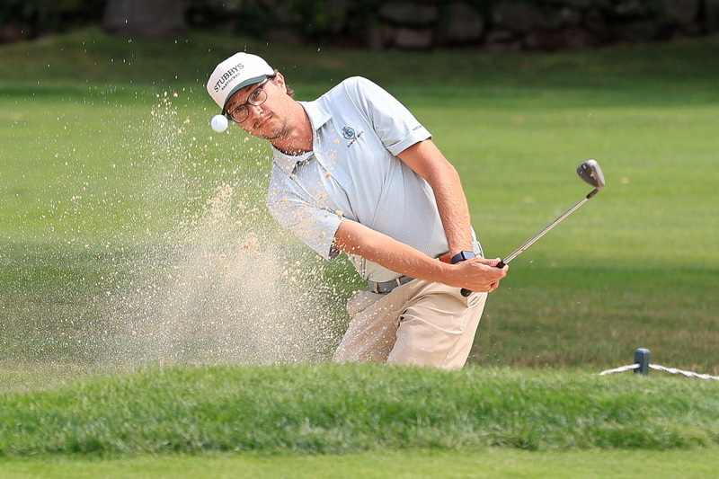 Nick Abaray sends sand flying as he pitches onto the green from a sand trap at the 2025 95th Annual Men's Four-Ball Tournament at the Country Club of New Bedford.  PHOTO PETER PEREIRA