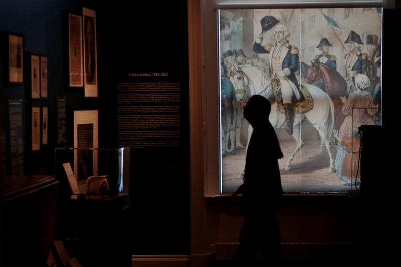 George Washington welcomes a visitor to the New Bedford Whaling Museum as she stops to look at the new Forging Independence - Building a Nation exhibit.  The exhibit invites visitors to form connections between historical events and today's issues, to consider what ideas are embodied in the terms and ideas of Independence and Nationhood. PHOTO PETER PEREIRA
