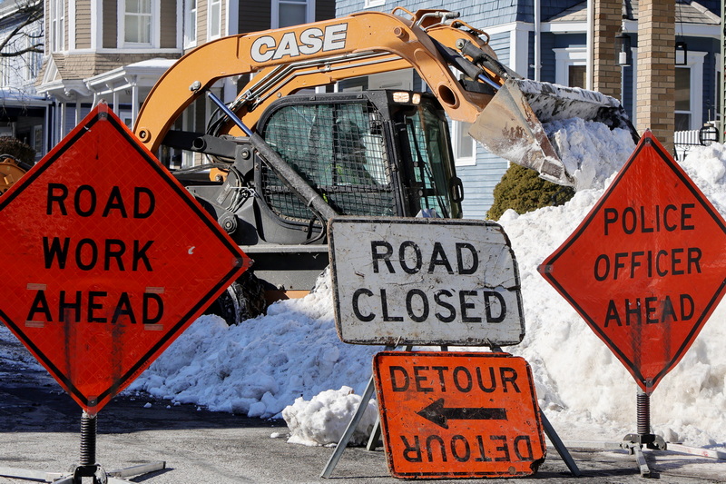 A DPI worker clears the snow from Union Street in New Bedford, MA as the city tries to clear out the excess snow piles from the side of the road. PHOTO PETER PEREIRA