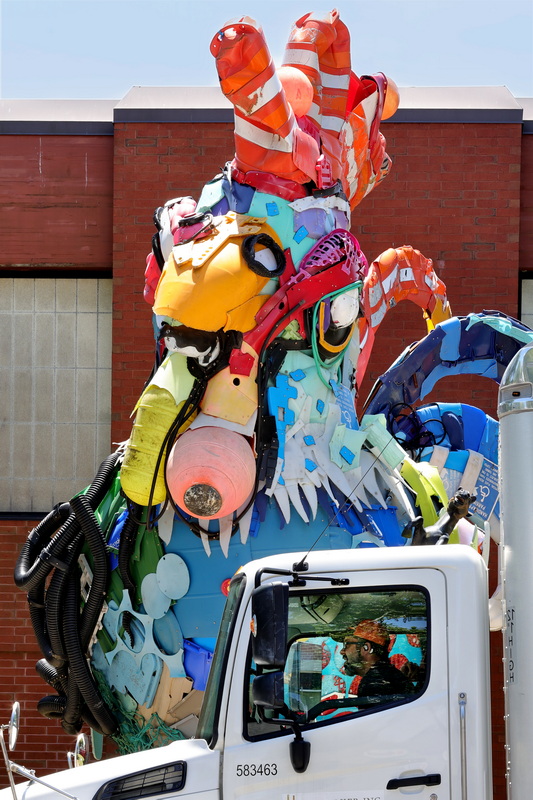 The 'Plastic Rooster' looks down at a truck driver stopped in front of him on Union Street in New Bedford, MA. PHOTO PETER PEREIRA