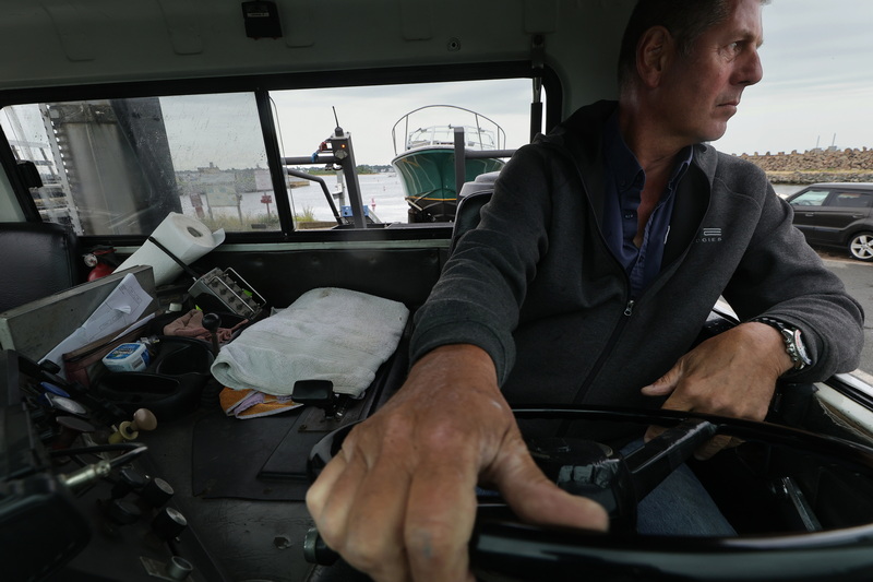 Bob Gardner from Bayline Boatyard & Transport carefully watches the rearview mirror of his transport truck while reversing a boat into the water at the Gifford Street boat ramp in New Bedford, MA on July 6, 2026. PHOTO PETER PEREIRA