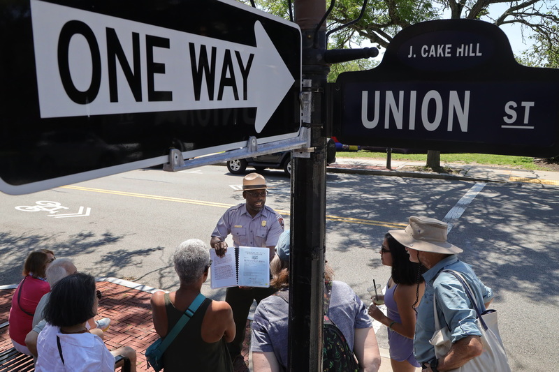Park Ranger, Rufai Shardow, stops at the intersection of Johnny Cake Hill and Union Street New Bedford, MA on July 24, 2026 during a walking tour of New Bedford Whaling National Historic Park. PHOTO PETER PEREIRA