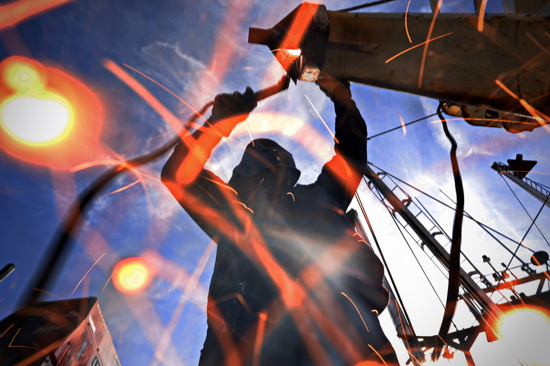 Sparks fly as Winston Reyes of Blue Fleet Welding makes repairs to a fishing boat in New Bedford, MA on August 4, 2026. PHOTO PETER PEREIRA