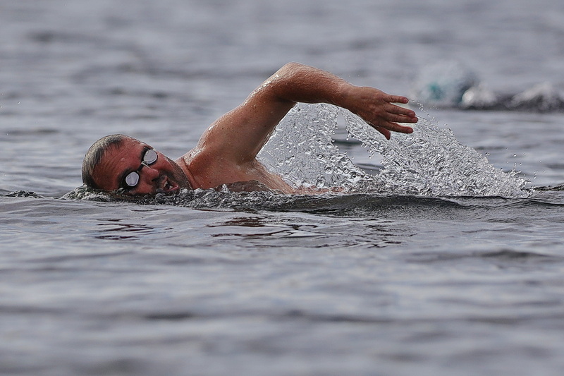 A curtain of water emerges from the bottom of a man's arm as he enjoys an open water swim off of East Beach in New Bedford, MA on September 9, 2026. PHOTO PETER PEREIRA