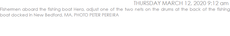 Fishermen aboard the fishing boat Hera, adjust one of the two nets on the drums at the back of the fishing boat docked in New Bedford, MA. PHOTO PETER PEREIRA