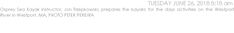 Osprey Sea Kayak instructor, Jon Trzepkowski, prepares the kayaks for the days activities on the Westport River in Westport, MA.
