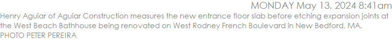 Henry Aguiar of Aguiar Construction measures the new entrance floor slab before etching expansion joints at the West Beach Bathhouse being renovated on West Rodney French Boulevard in New Bedford, MA. PHOTO PETER PEREIRA
