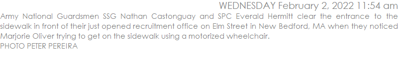 Army National Guardsmen SSG Nathan Castonguay and SPC Everald Hermitt clear the entrance to the sidewalk in front of their just opened recruitment office on Elm Street in New Bedford, MA when they noticed Marjorie Oliver trying to get on the sidewalk using a motorized wheelchair.