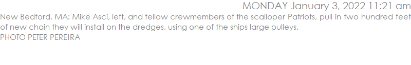 New Bedford, MA: Mike Asci, left, and fellow crewmembers of the scalloper Patriots, pull in two hundred feet of new chain they will install on the dredges, using one of the ships large pulleys.