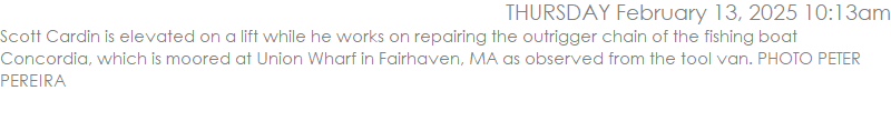 Scott Cardin is elevated on a lift while he works on repairing the outrigger chain of the fishing boat Concordia, which is moored at Union Wharf in Fairhaven, MA as observed from the tool van. PHOTO PETER PEREIRA