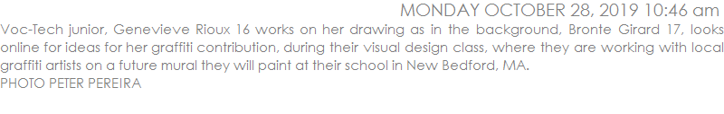 Voc-Tech junior, Genevieve Rioux 16 works on her drawing as in the background, Bronte Girard 17, looks online for ideas for her graffiti contribution, during their visual design class, where they are working with local graffiti artists on a future mural they will paint at their school in New Bedford, MA. 