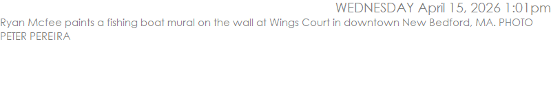 Ryan Mcfee paints a fishing boat mural on the wall at Wings Court in downtown New Bedford, MA. PHOTO PETER PEREIRA