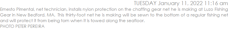 Ernesto Pimental, net technician, installs the nylon protection on the chaffing gear net he is making at Luzo Fishing Gear in New Bedford, MA.  This thirty foot net he is making will be sewn to the bottom of a regular fishing net and will protect it from being torn when it is towed along the seafloor.