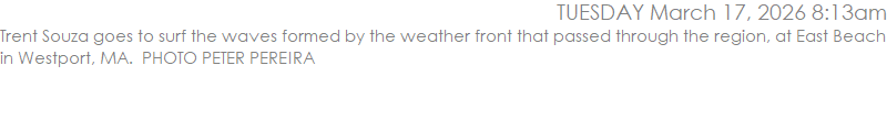 Trent Souza goes to surf the waves formed by the weather front that passed through the region, at East Beach in Westport, MA.  PHOTO PETER PEREIRA