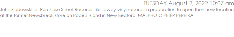 John Sladewski, of Purchase Street Records, files away vinyl records in preparation to open their new location at the former Newsbreak store on Pope's Island in New Bedford, MA. PHOTO PETER PEREIRA