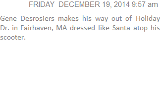 Gene Desrosiers makes his way out of Holiday Dr. in Fairhaven, MA dressed like Santa atop his scooter.
