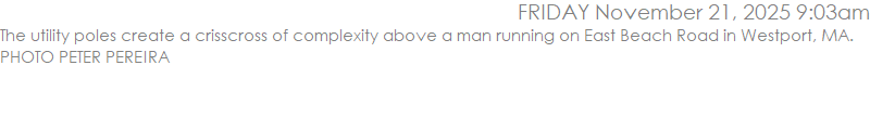 The utility poles create a crisscross of complexity above a man running on East Beach Road in Westport, MA. PHOTO PETER PEREIRA