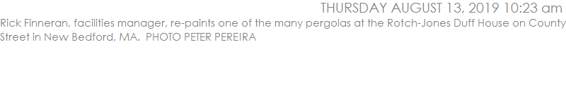 Rick Finneran, facilities manager, re-paints one of the many pergolas at the Rotch-Jones Duff House on County Street in New Bedford, MA.  PHOTO PETER PEREIRA