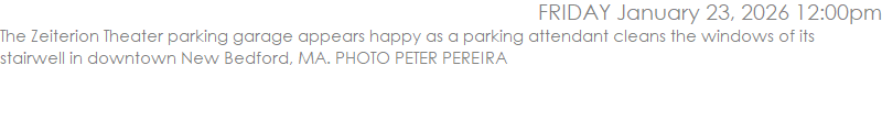 The Zeiterion Theater parking garage appears happy as a parking attendant cleans the windows of its stairwell in downtown New Bedford, MA. PHOTO PETER PEREIRA