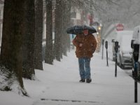 A man makes his way down S Second Street in downtown New Bedford as a snowstorm sweeps across the region. PHOTOS PETER PEREIRA