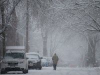 A man makes his way down Center Street in Fairhaven as heavy snow falls across the region. PHOTOS PETER PEREIRA