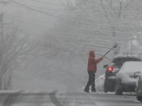 A man digs his car out of the snow on Maple Street in New Bedford as heavy snow falls across the region. PHOTOS PETER PEREIRA