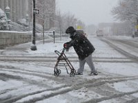 A man struggles to make his way across Pleasant Street in New Bedford, as heavy snow falls across the region. PHOTOS PETER PEREIRA