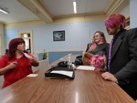 New Bedford clerk, Maria Brilhante takes the marriage application for Kelly Hayden and David McDonough after they arrived at New Bedford City Hall to be married on Valentine's Day. PHOTO PETER PEREIRA