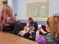 Kelly Hayden, bride, left, and Maid of Honor Lea Rosa, right, take a photo of David McDonough and Kelly's daughter, Bela Rose, inside of the Clerk's Office in New Bedford City Hall before they were married on Valentine's Day. PHOTO PETER PEREIRA