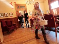 Daughter to bride, Bella Rose, spreads red paper circles from a basket, as in the background, Jim Hayden prepares to walk his daughter Kelly Hayden up the 'aisle' inside a room in New Bedford City Hall where Kelly Hayden and David McDonough were married on Valentine's Day. PHOTO PETER PEREIRA