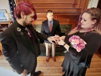 New Bedford City Clerk, Jim Farias, asks Kelly Hayden to place a wedding ring on her new husband David McDonough during their wedding on Valentine's Day at New Bedford City Hall.  PHOTO PETER PEREIRA