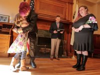 Bella Rose, daughter of Kelly Hayden, is overcome with emotion after David McDonough asked her if he could be her father, during the wedding ceremony of David McDonough and Kelly Hayden, right, on Valentine's Day at New Bedford City Hall. PHOTO PETER PEREIRA