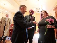 New Bedford City Clerk, Dennis Farias, give Kelly Hayden and David McDonough their new marriage certificate after the couple were married on Valentine's Day in New Bedford City Hall.   PHOTO PETER PEREIRA