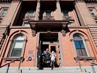 Kelly Hayden and David McDonough are escorted out of New Bedford City Hall by their daughter Bella Rose after getting married on Valentine's Day.  PHOTO PETER PEREIRA