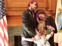 Newlyweds David McDonough and Kelly Hayden are joined by Kelly's daughter, Bella Rose, in a group embrace, after the couple were married on Valentine's Day at New Bedford City Hall.   PHOTO PETER PEREIRA