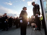 Tiverton Assistant Deputy State Fire Marshal, Daniel Murphy Sr., stands on a chair as he organizes firefighters from across two states to line up out side of the Hathaway Community Home for Funerals in Somerset, for the wake of Somerset Fire Chief Scott Jepson.  [ PETER PEREIRA/THE STANDARD-TIMES/SCMG ]