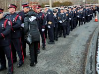 Firefighters and civilians seek share emotion, as they prepare to march to the Hathaway Community Home for Funerals in Somerset, for the wake of Somerset Fire Chief Scott Jepson.  [ PETER PEREIRA/THE STANDARD-TIMES/SCMG ]