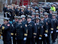 Firefighters from across two states line up outside of the Hathaway Community Home for Funerals in Somerset, for the wake of Somerset Fire Chief Scott Jepson.  [ PETER PEREIRA/THE STANDARD-TIMES/SCMG ]