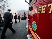 Firefighters make their way past a Somerset apparatus after attending the wake of Somerset Fire Chief Scott Jepson.  [ PETER PEREIRA/THE STANDARD-TIMES/SCMG ]