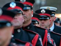 Firefighters from across two states line up outside of the Hathaway Community Home for Funerals in Somerset, for the wake of Somerset Fire Chief Scott Jepson.  [ PETER PEREIRA/THE STANDARD-TIMES/SCMG ]