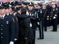 Firefighters and civilians seek share emotion, as they prepare to march to the Hathaway Community Home for Funerals in Somerset, for the wake of Somerset Fire Chief Scott Jepson.  [ PETER PEREIRA/THE STANDARD-TIMES/SCMG ]