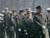 Snow starts to fall, as firefighters wait in line outside of the Hathaway Community Home for Funerals in Somerset, for the wake of Somerset Fire Chief Scott Jepson.   [ PETER PEREIRA/THE STANDARD-TIMES/SCMG ]