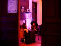 A fortune teller offers an attendee a glimpse into her future inside one of the rooms at the second Annual Whaling City Witches' Ball held at the Tryworks Auditorium of the First Unitarian Church building in downtown New Bedford.    PHOTO PETER PEREIRA