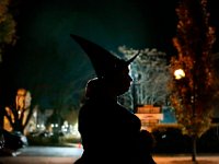 The street lights in the distance create a halo of a woman waiting to get into the second Annual Whaling City Witches' Ball held at the Tryworks Auditorium of the First Unitarian Church building in downtown New Bedford.    PHOTO PETER PEREIRA