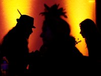 Colors are reflected on the walls as fortune tellers are seen at the second Annual Whaling City Witches'' Ball held at the Tryworks Auditorium of the First Unitarian Church building in downtown New Bedford.  PHOTO PETER PEREIRA