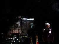 Daniel Whitaker of AP Whitaker & Sons general contractor is illuminated by a ray of light inside the former Capitol Theater location on Acushnet Avenue in New Bedford which will be developed into a retail space along with six mixed-income housing units.