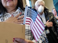 New citizents Pledge Allegiance during a naturalization ceremony held at the Immigrants' Assistance Center in New Bedford where twenty three people from fifteen countries became United States citizens.