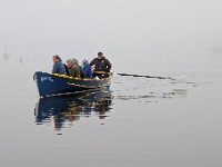 Members of the Buzzards Bay Rowing Club make their way across New Bedford harbor on a foggy morning.