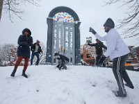 UMass Dartmouth engineering students from Hyderabad, India play with snow for the first time ever at Custom House Square in New Bedford, MA on February 13, 2024 as heavy snow falls across the region.